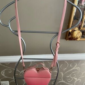 Soft Pink Crossbody Bag with Structured Shape and Polished Finish